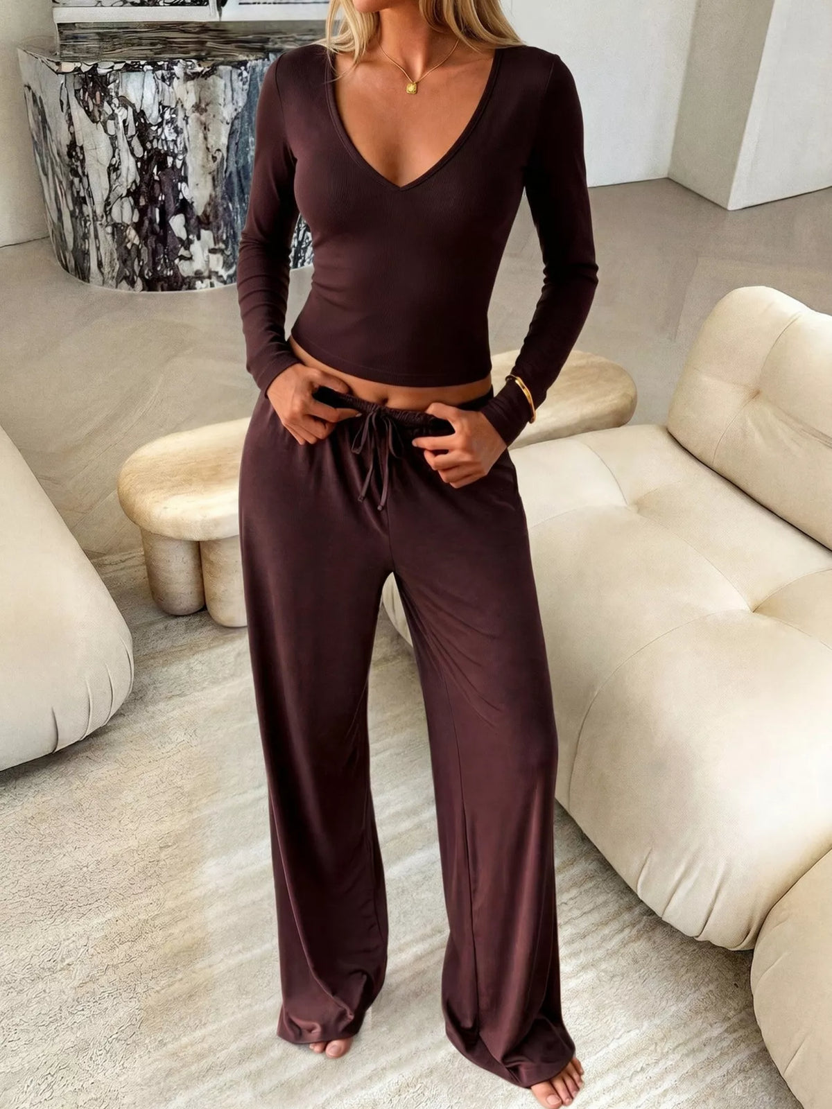 Plush Fashion Hub matching set with V-neck long sleeve top and wide-leg pants, soft fabric, stylish loungewear ensemble.