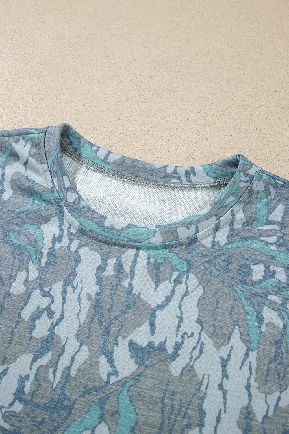 Multicolour abstract botanical print top and drawstring pants set by Trendsi, featuring vibrant, flowy fabric and stylish design.
