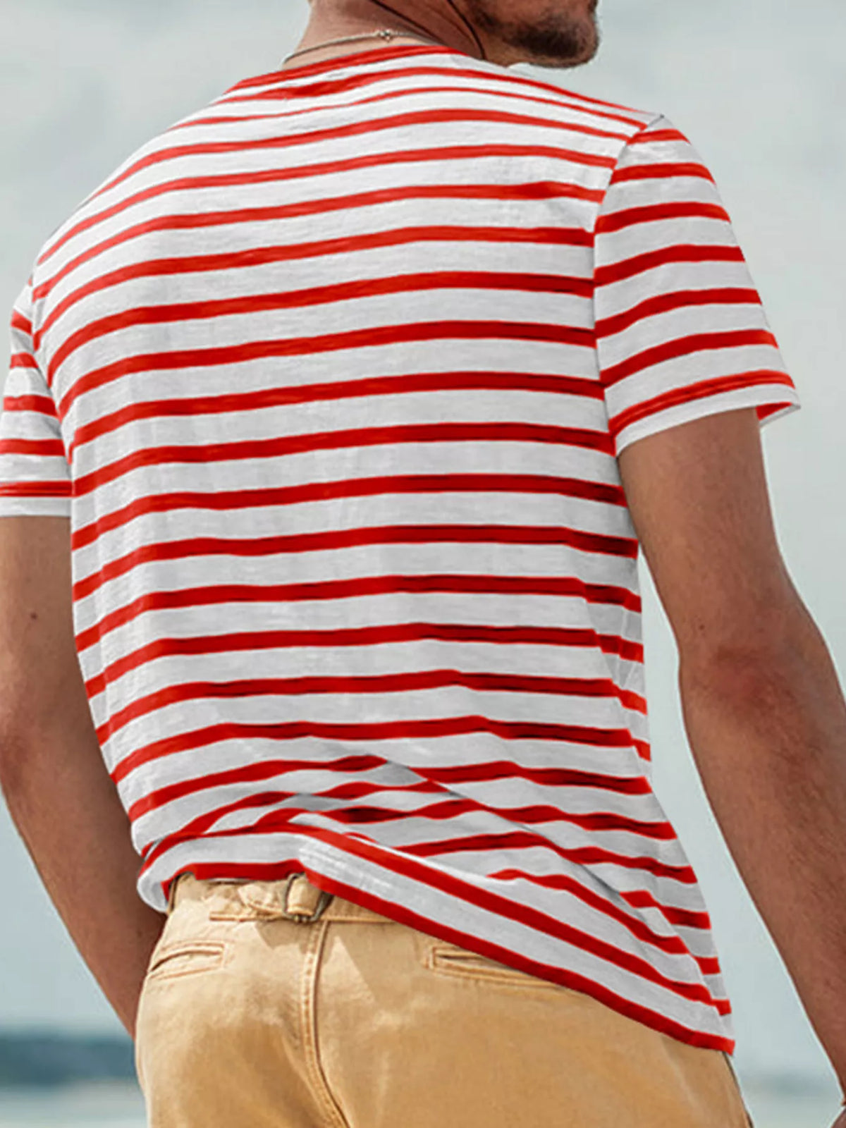 Plus size men's striped pocket short sleeve T-shirt by Plush Fashion Hub, showing front view with pocket and colorful stripes.
