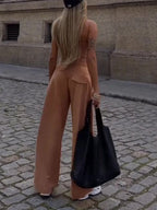 FitiqueFit camel spaghetti strap corset top and wide-leg pants casualwear set, shown on a model.