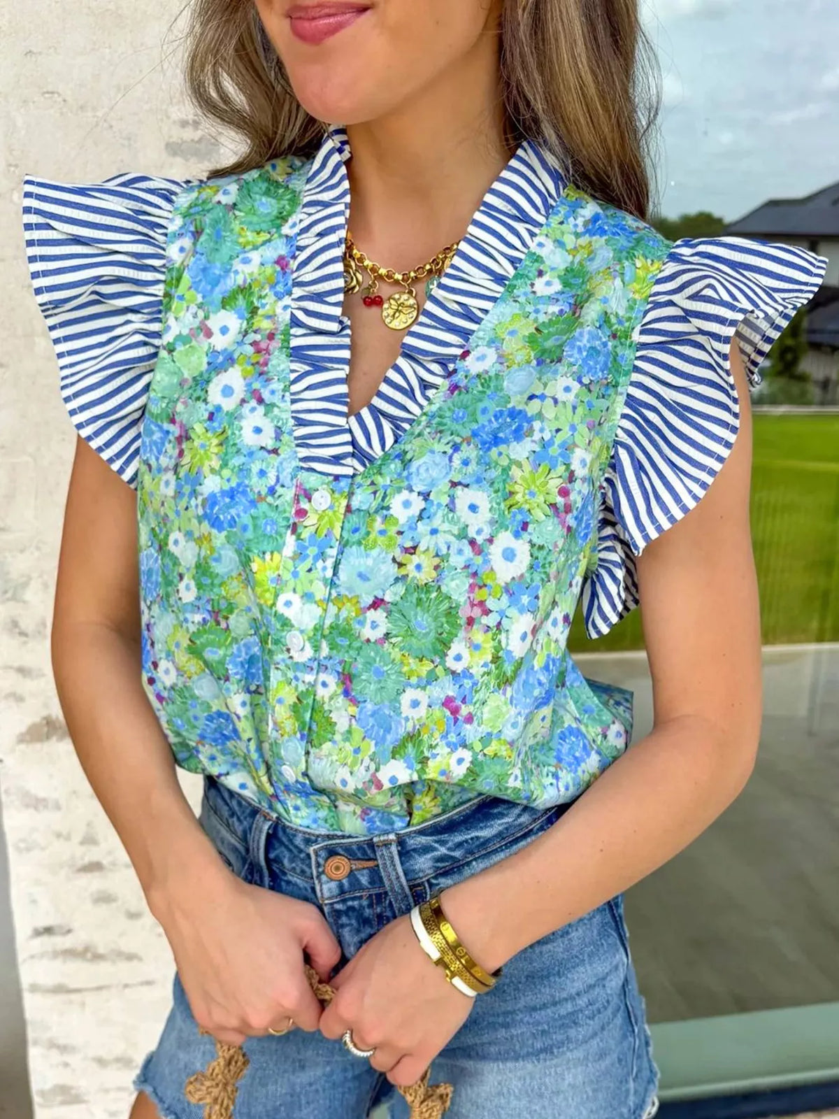 Cotton floral patchwork V-neck dress with flutter sleeves from Plush Fashion Hub, featuring colorful floral patterns and a relaxed fit.