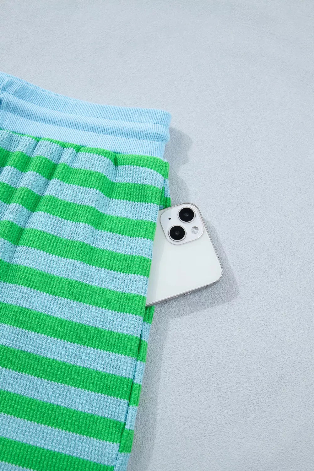 Stripe colorblock puff sleeve top and drawstring shorts matching set by Plush Fashion Hub, showcasing stylish, coordinated summer outfit.