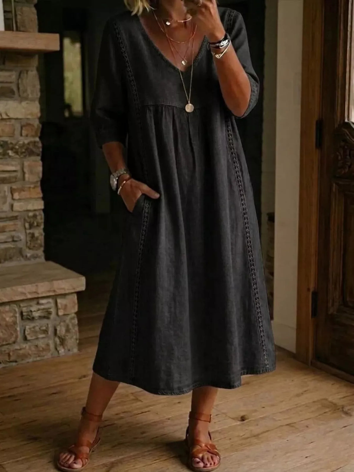 Plus size full-length V-neck midi dress with 3/4 sleeves from Trendsi, showcasing a stylish and comfortable design.