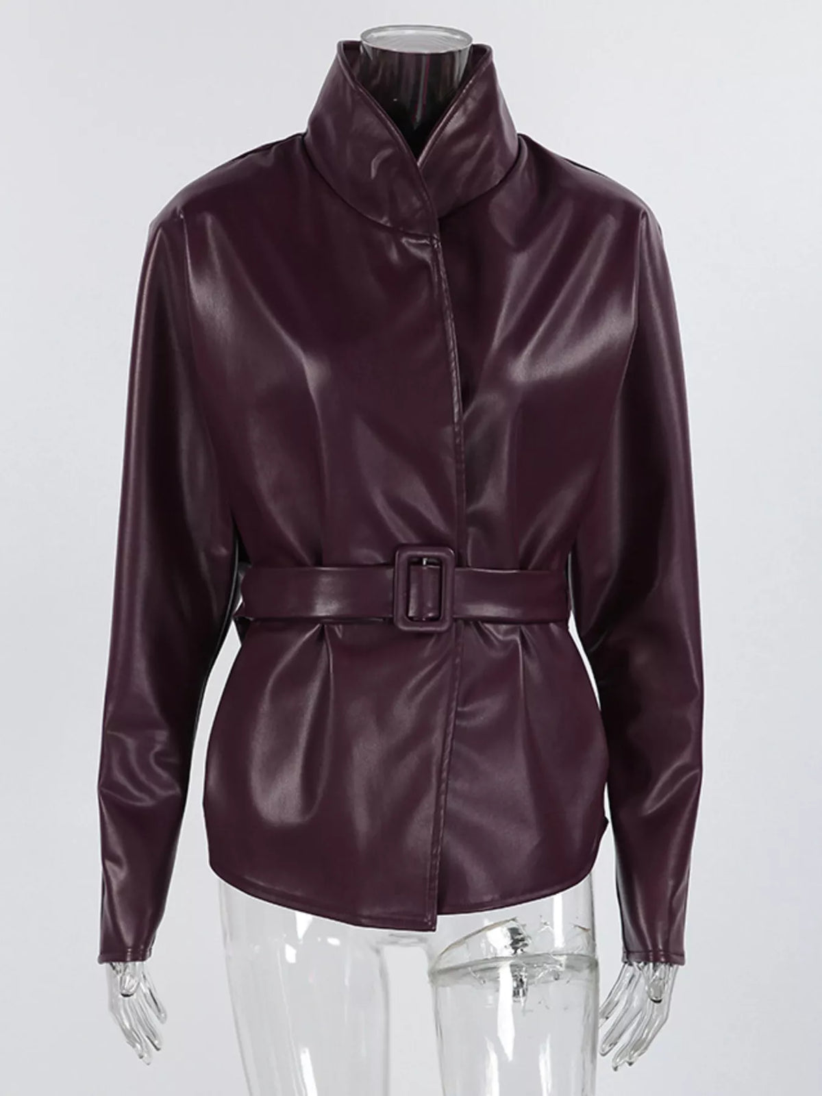 Women's faux leather jacket with stand collar and belted design, trendy jacket by Trendsi shown in black with silver hardware.