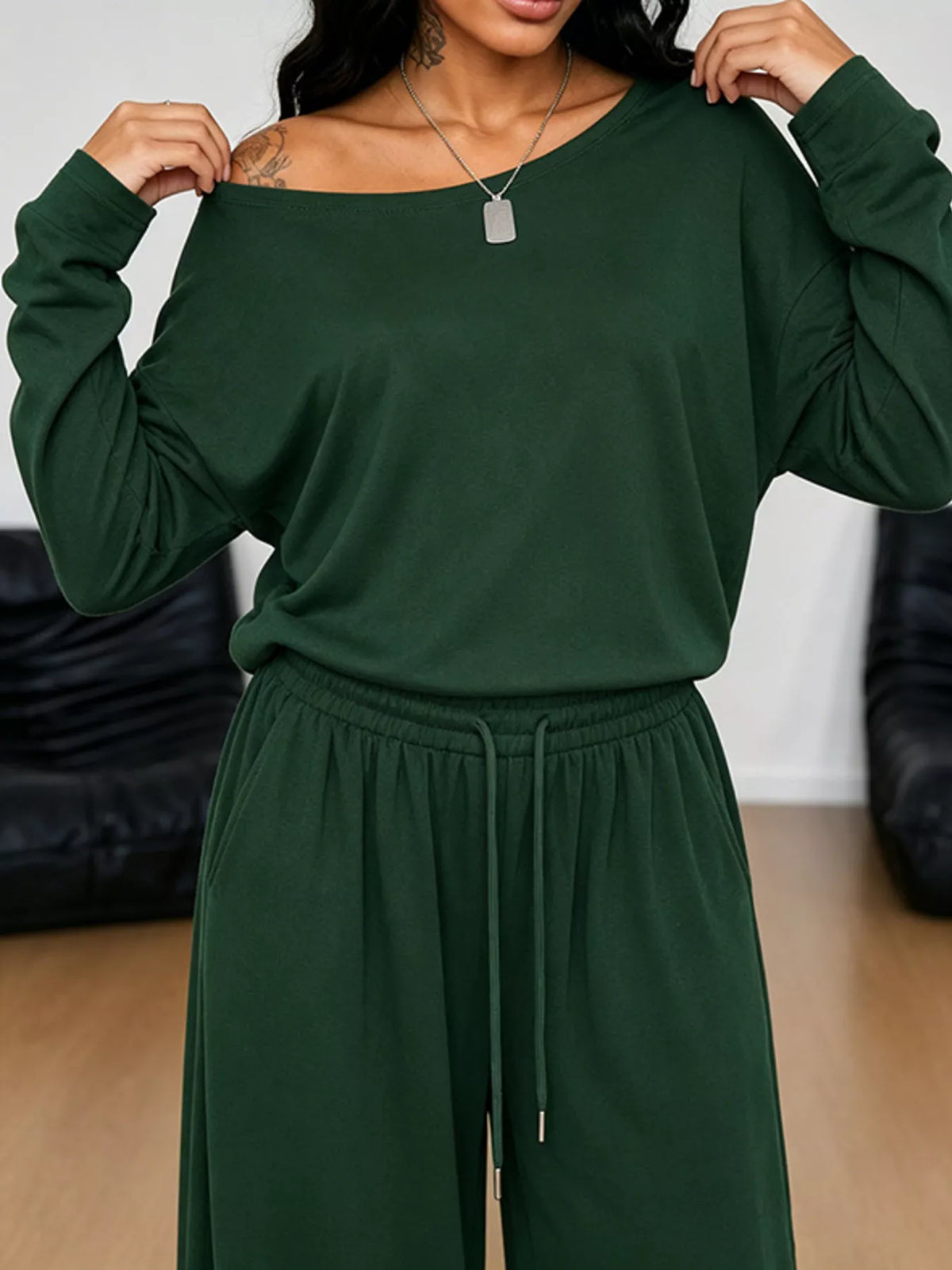 Plus size one-shoulder top and drawstring pants matching set from Trendsi, featuring stylish design and comfortable fit.