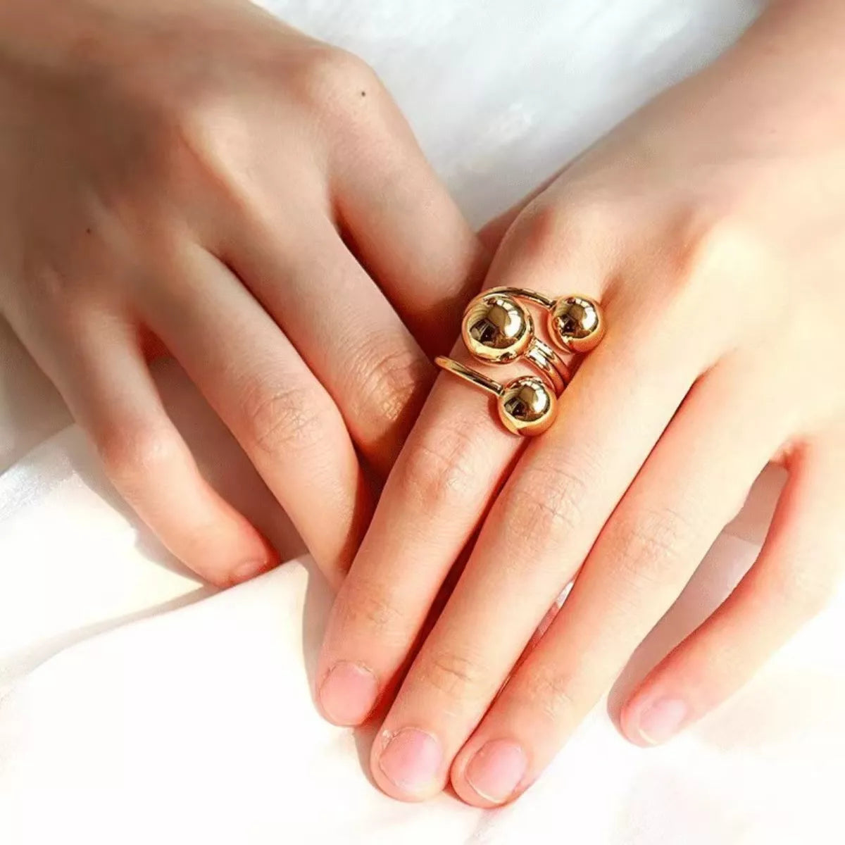 Multi-layered ball ring from Plush Fashion Hub featuring stacked silver-tone spheres on a sleek ring band