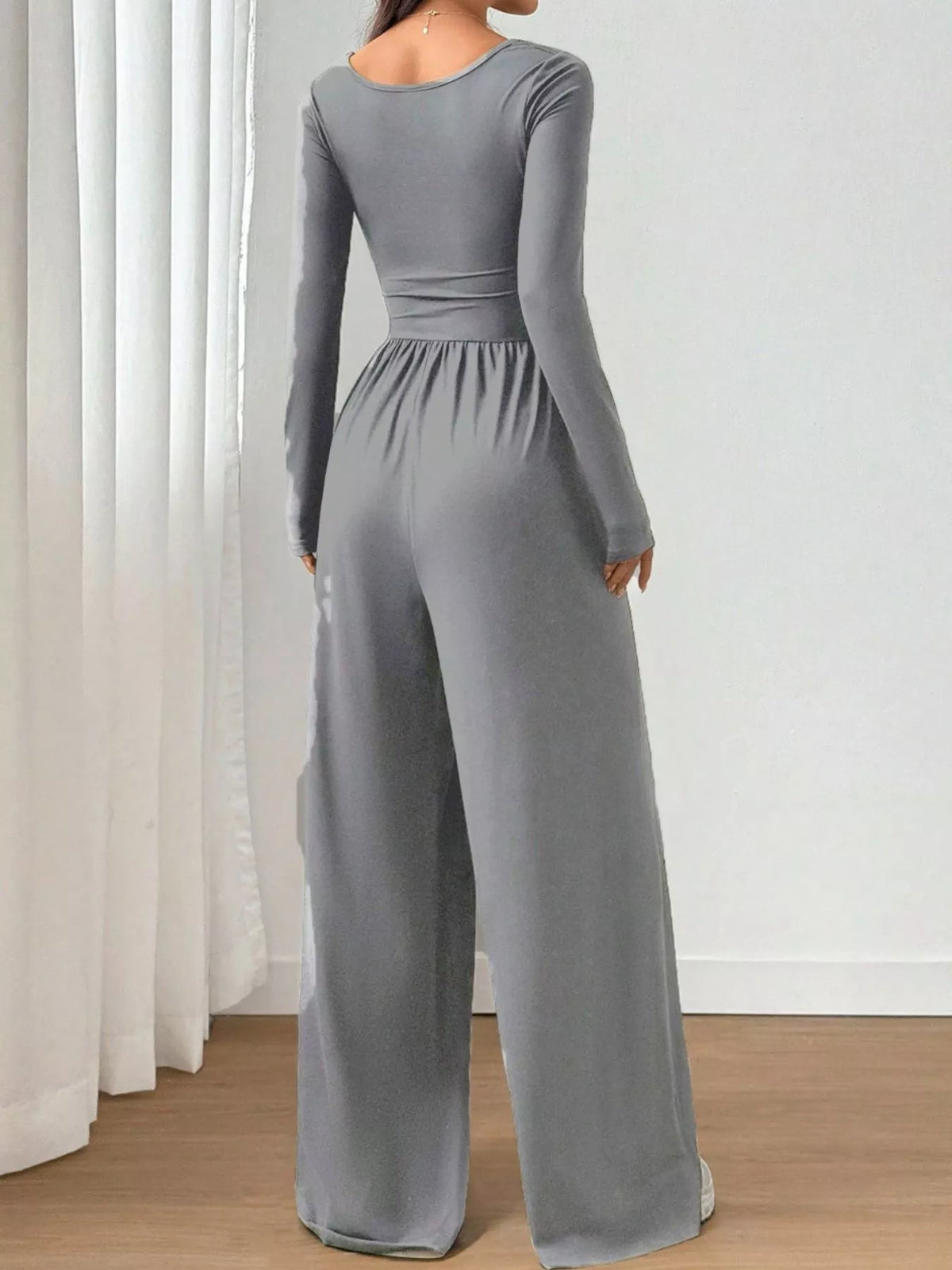 Ruched square neck wide-leg jumpsuit by Trendsi, featuring a stylish design and comfortable fit, shown in the image.