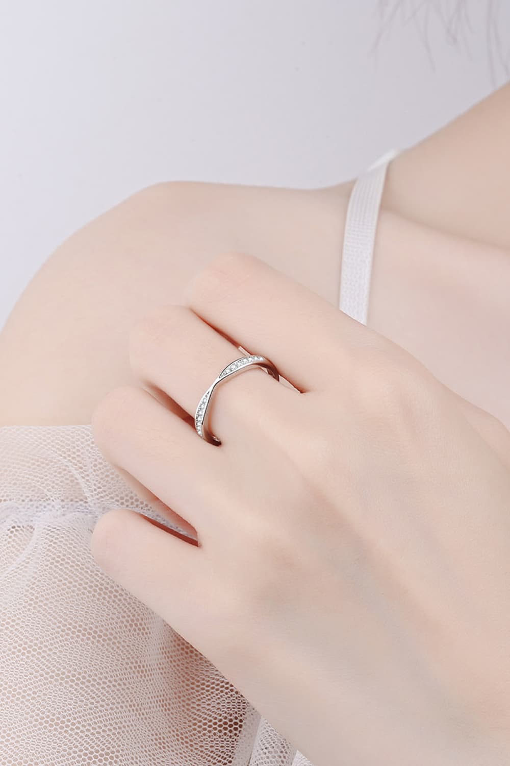Rhodium-plated moissanite ring from Plush Fashion Hub, showcasing a sparkling, elegant band with intricate design details.