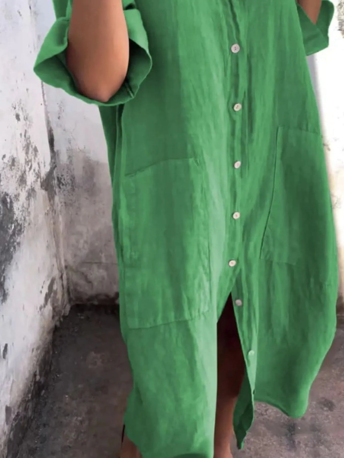 Plus size linen button-down shirt dress from Trendsi featuring a casual, full-length design with a collar and long sleeves.