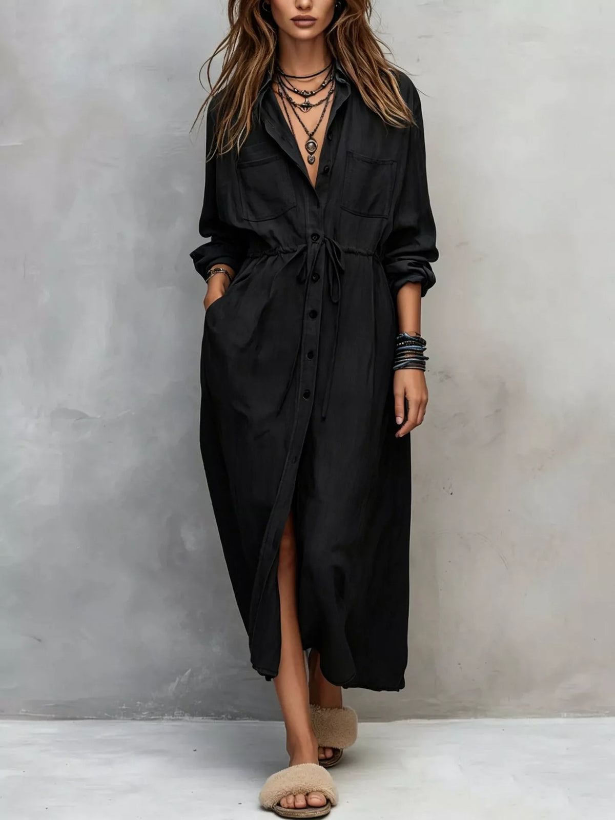 Plus size long sleeve button-front shirt dress by Trendsi, featuring a relaxed fit and classic collar, shown in a side view.