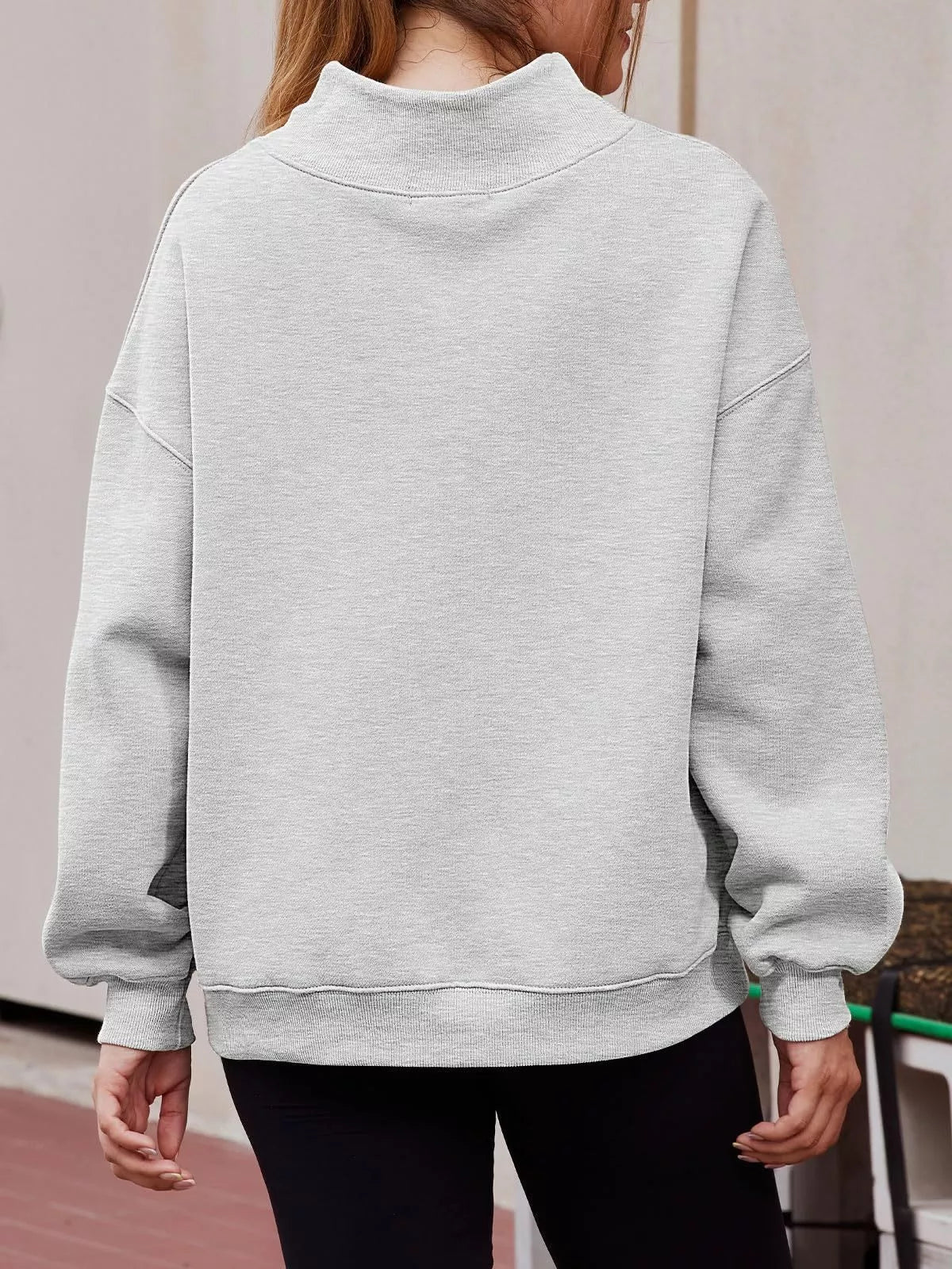 Women’s oversized plush fashion hub sweatshirt with mock neck, dropped shoulders, and casual relaxed fit in soft fabric.