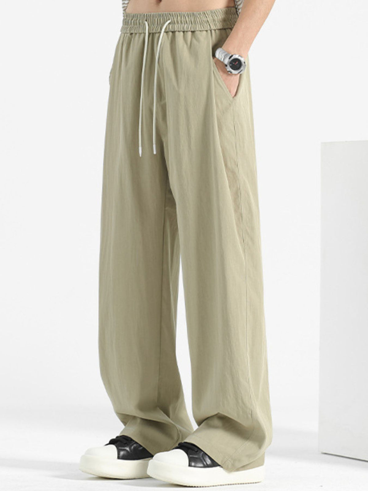 Men's loose fit casual pants with drawstring waist from Plush Fashion Hub, shown in a relaxed fit style.