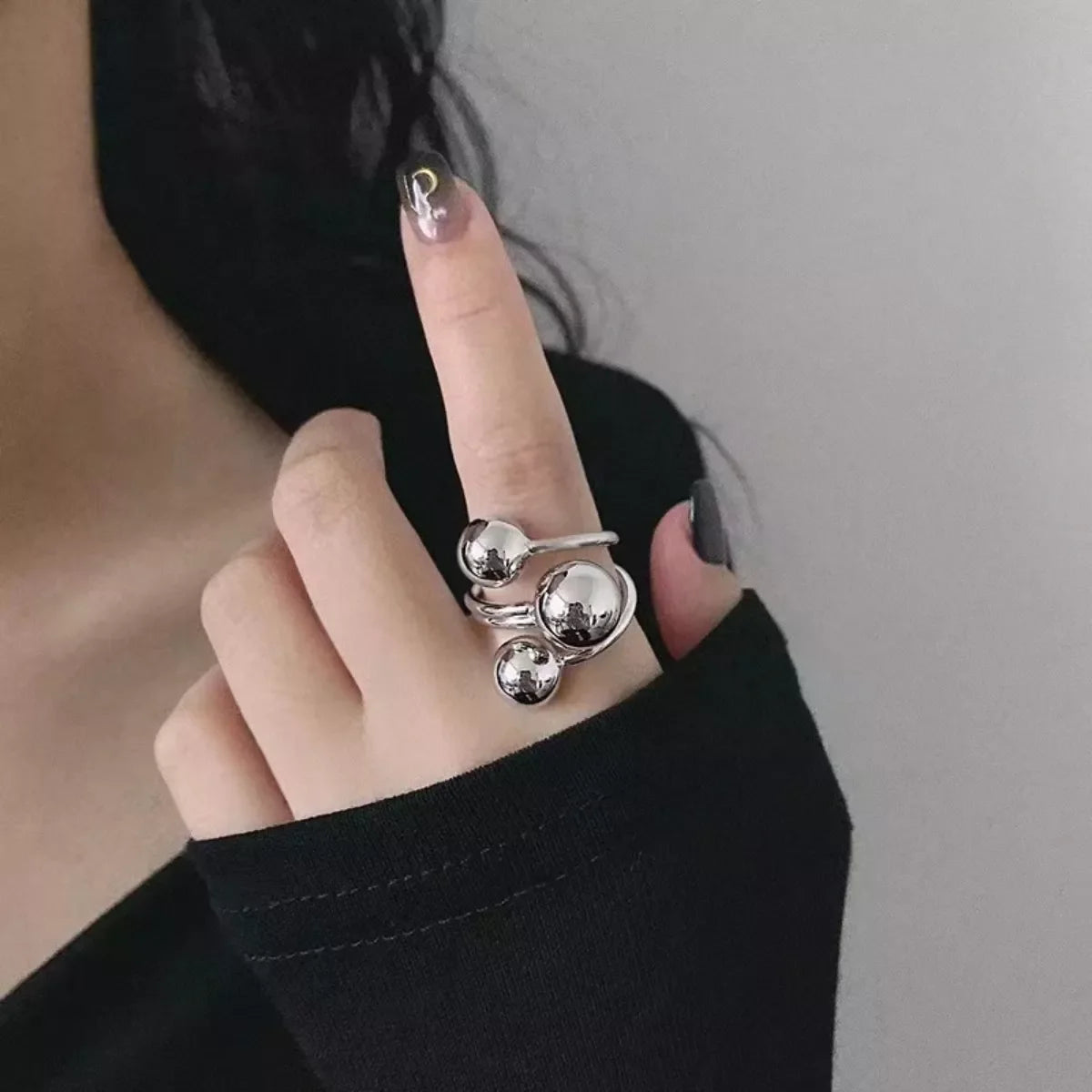 Multi-layered ball ring from Plush Fashion Hub featuring stacked silver-tone spheres on a sleek ring band.