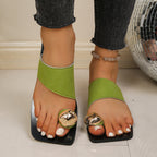 Women's stylish flat sandals with toe ring design, vegan leather summer shoes by Trendsi, featuring comfortable, casual footwear.