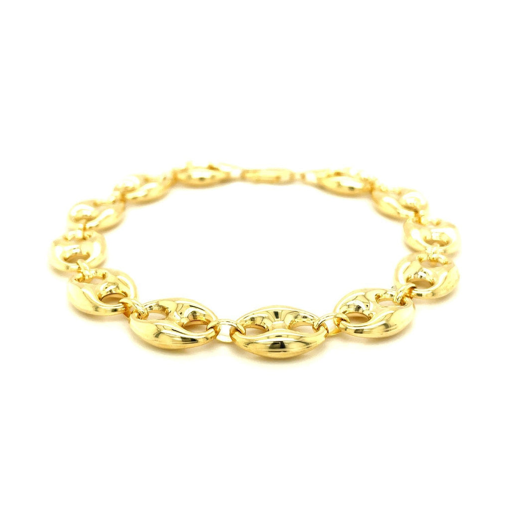11.0mm 14k yellow gold puffed mariner link bracelet with polished finish, showcasing its chunky, textured design.