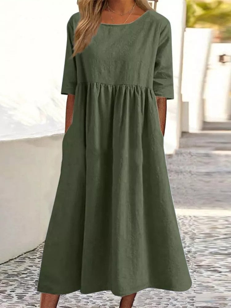Plus size midi casual dress by FitiqueFit featuring a round neckline and front pockets, perfect for comfortable everyday wear.