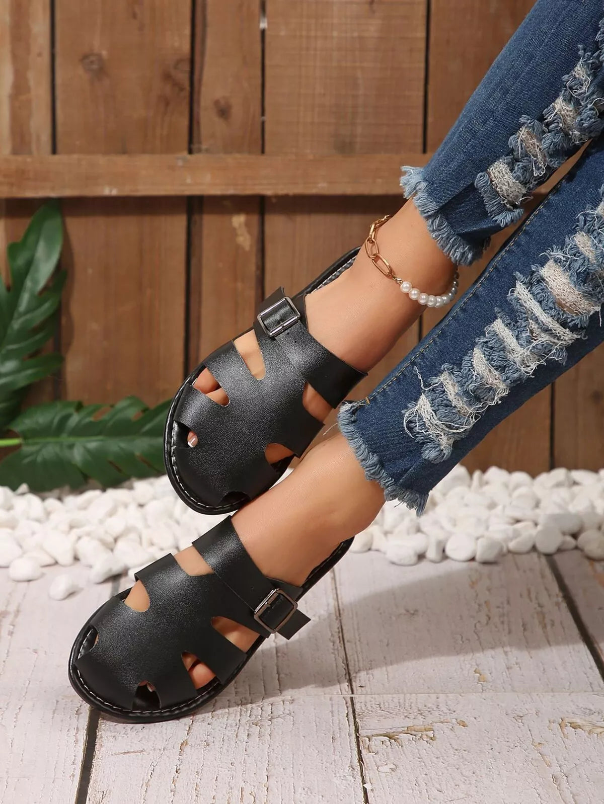 Comfortable slip-on leather sandals with adjustable buckle from Plush Fashion Hub, featuring a casual design and supportive sole.