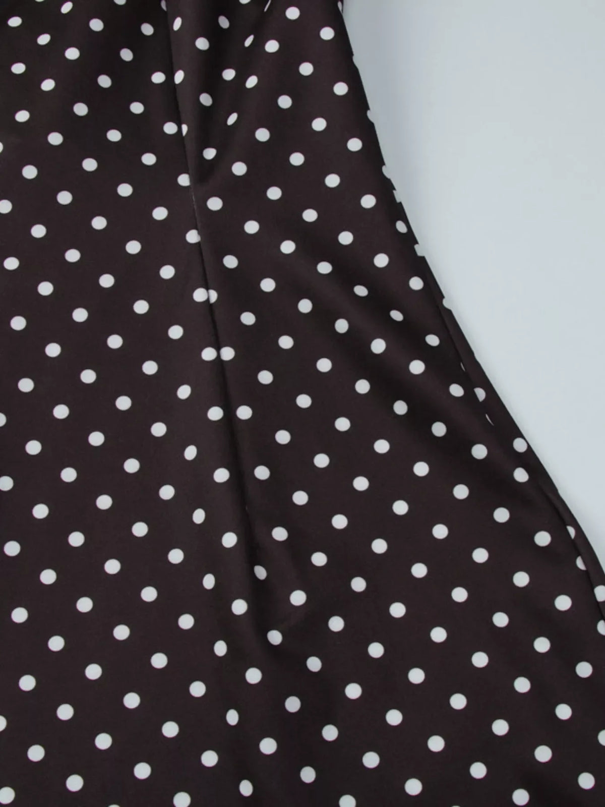 Polka dot cut-out front mini dress by Plush Fashion Hub featuring a stylish design and a fitted silhouette.