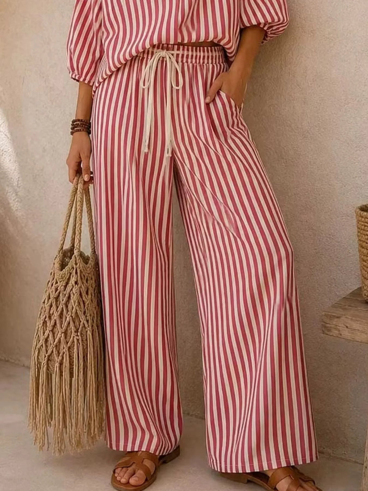 Plus size striped puff sleeve shirt and wide-leg drawstring pants set, trendy matching outfit by Trendsi.