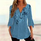 Women’s printed spike button casual top with three-quarter sleeves from Plush Fashion Hub, featuring vibrant patterns and comfortable fit.