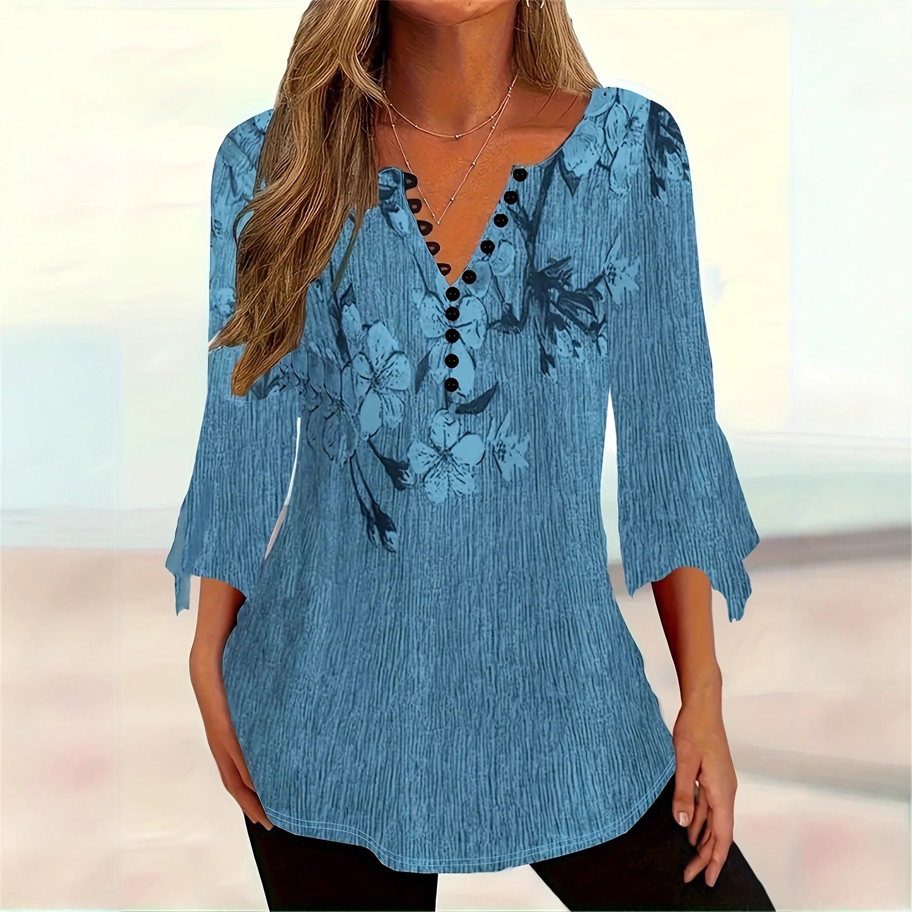 Women’s printed spike button casual top with three-quarter sleeves from Plush Fashion Hub, featuring vibrant patterns and comfortable fit.