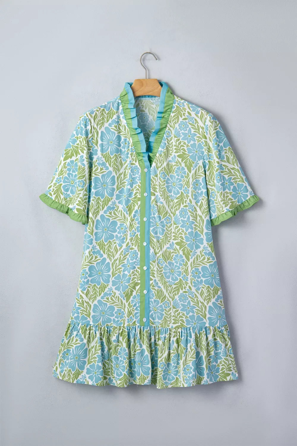 Floral print ruffle hem button-up mini dress from Trendsi, featuring a feminine design and lightweight fabric.