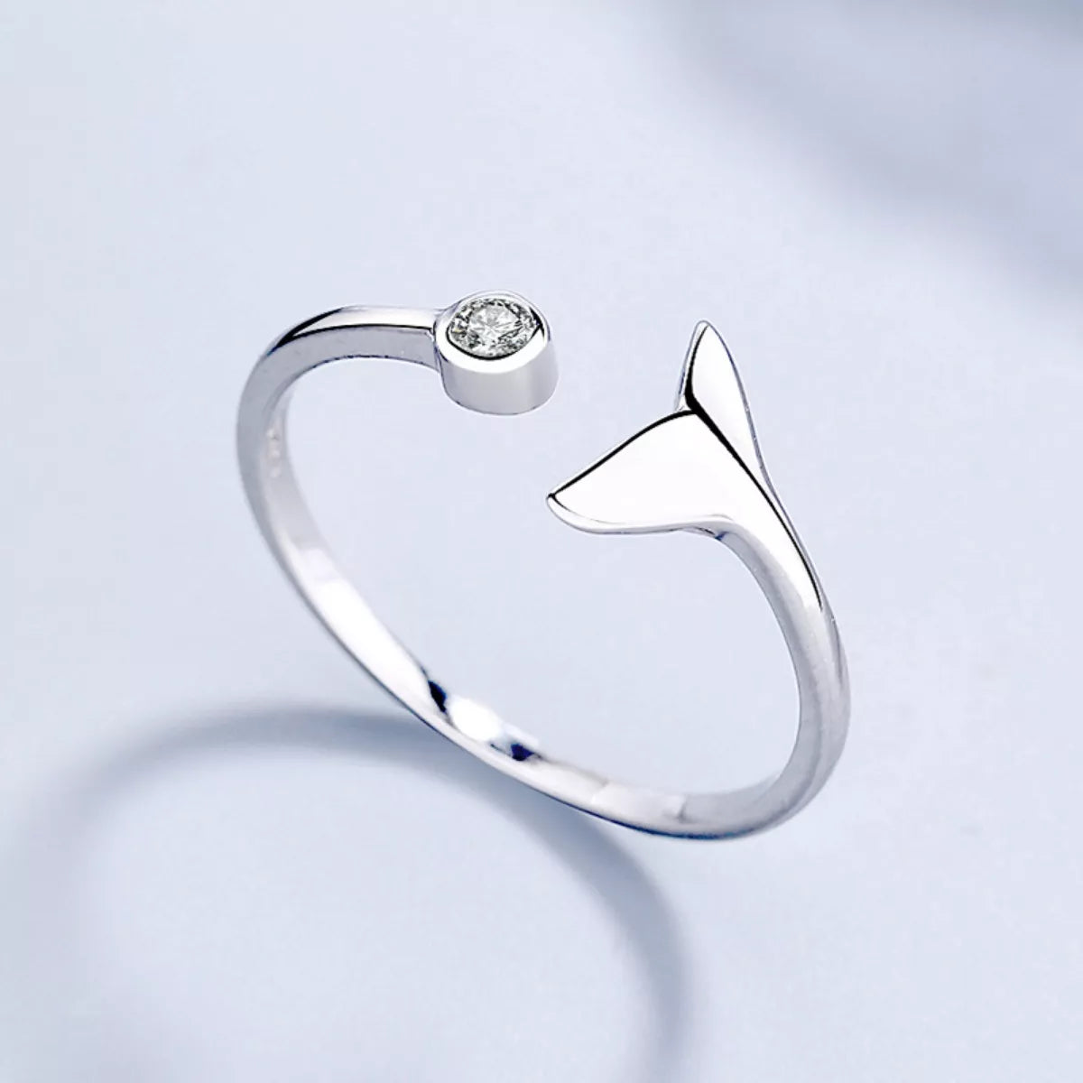 Sterling silver whale tail ring from Plush Fashion Hub featuring a detailed marine-inspired design on a sleek band.