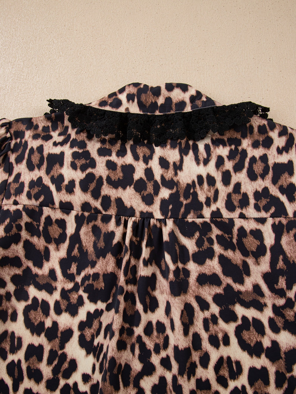 Leopard print short sleeve blouse with lace trim and button front, trendy women's top by Trendsi.