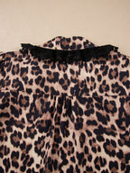Leopard print short sleeve blouse with lace trim and button front, trendy women's top by Trendsi.