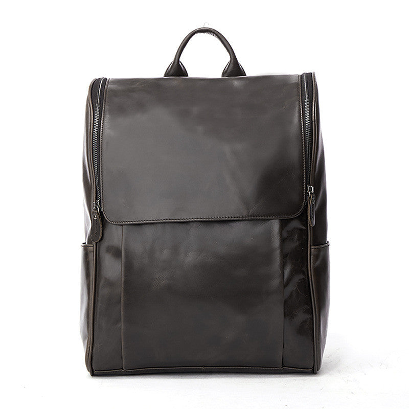 Black leather computer backpack by Pi-Mart, first layer leather bag with multiple compartments and adjustable straps.