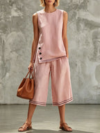 Women's tank top and wide-leg pants set by Plush Fashion Hub featuring side split, pockets, and button details.
