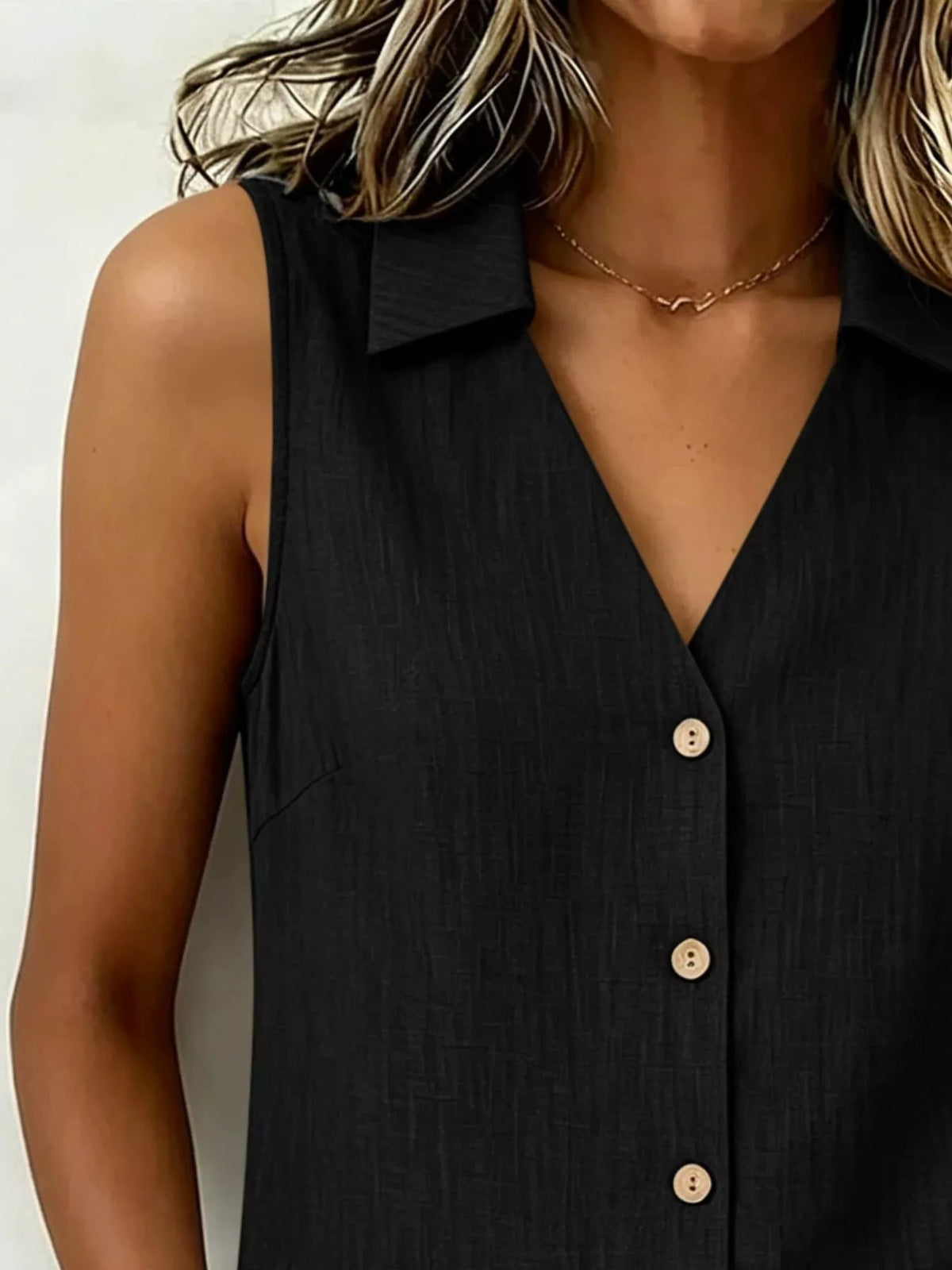Plus size sleeveless button-up collared top from Trendsi, shown in a full view with front buttons and collar detail.
