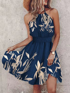 Paisley print halter neck mini dress by Plush Fashion Hub, featuring a stylish design and vibrant pattern.