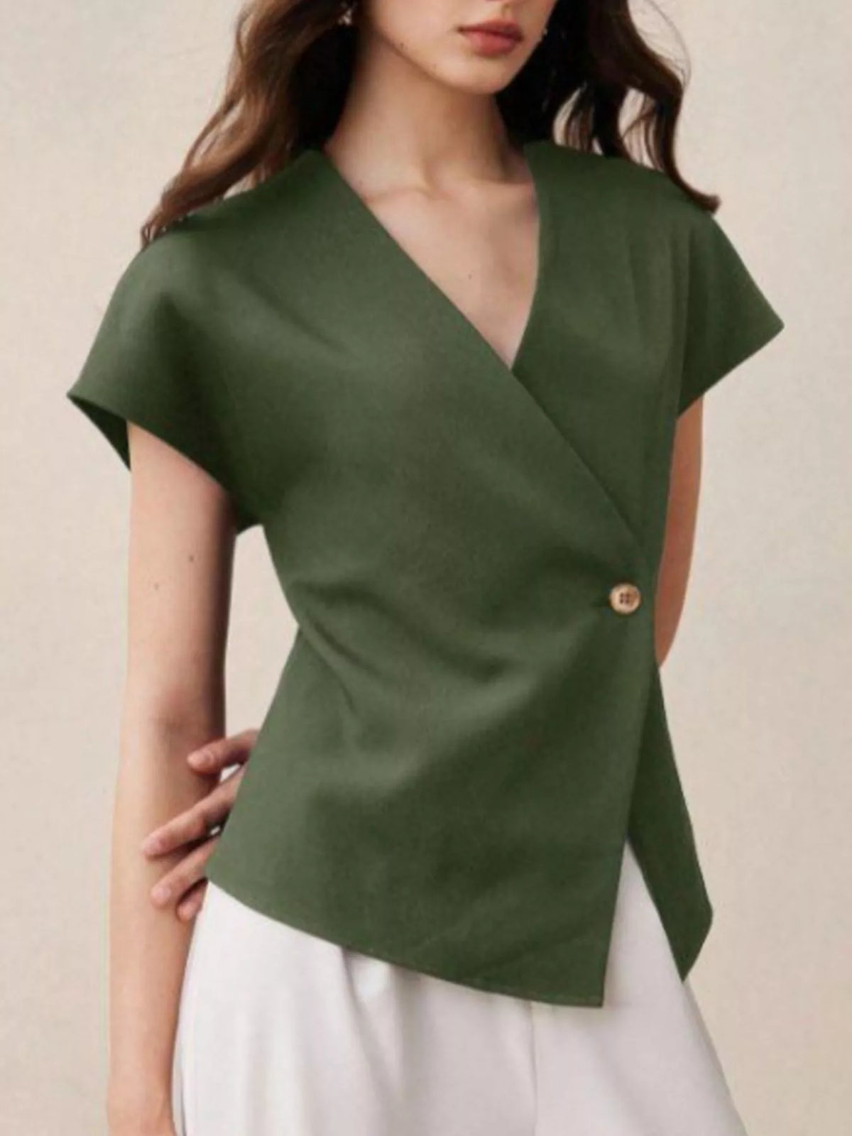 Plush Fashion Hub wrap-front one-button shirt, stylish tops in soft fabric with a modern wrap design and front button closure.