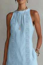 Women's sleeveless maxi dress with side slit and pockets by Trendsi, shown in a flowing fabric with a relaxed fit.