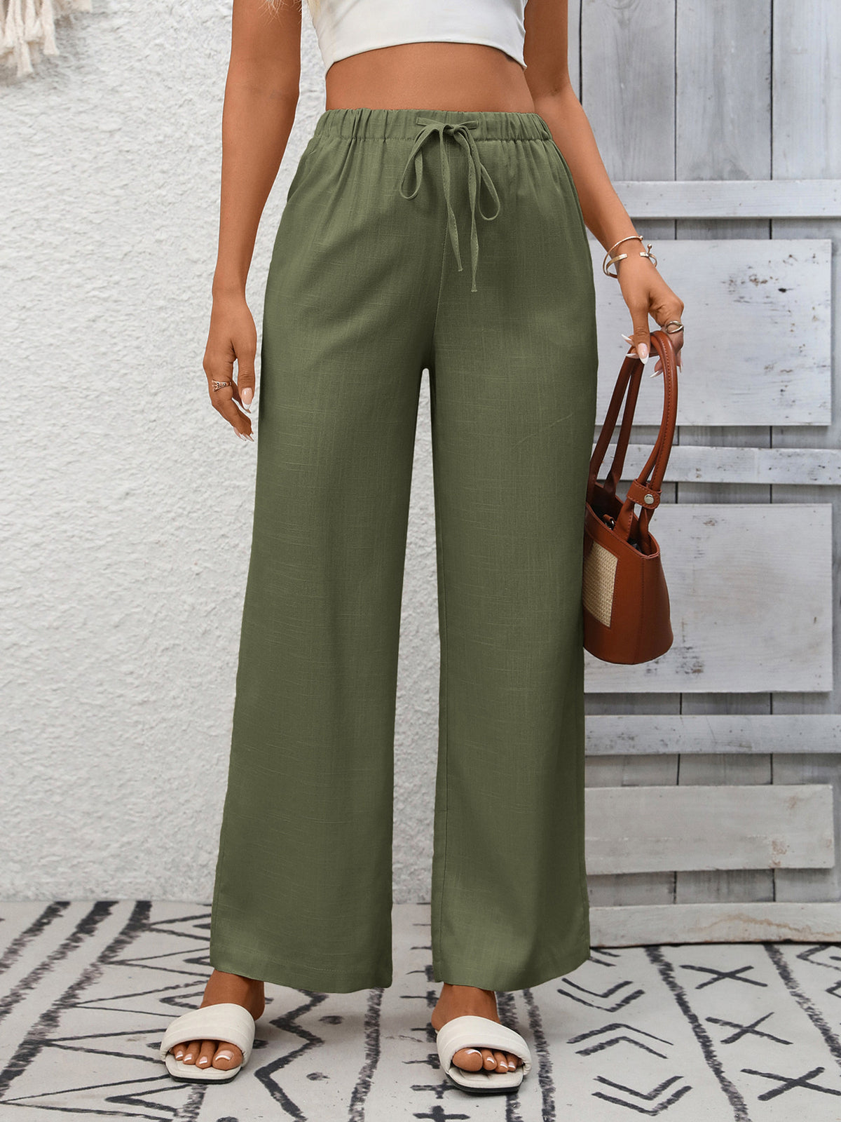 Women's high-waisted wide-leg drawstring pants in soft breathable viscose by Plush Fashion Hub, shown in a relaxed fit style.