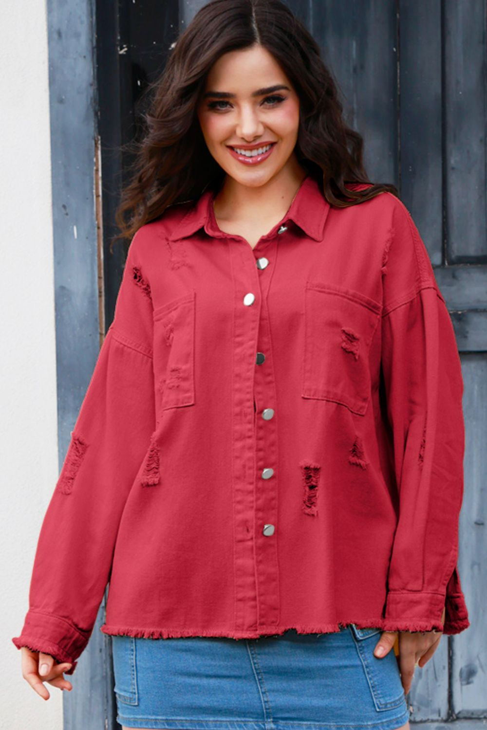 Distressed button-up raw hem denim jacket by Plush Fashion Hub, featuring a casual fit and stylish worn-in look.