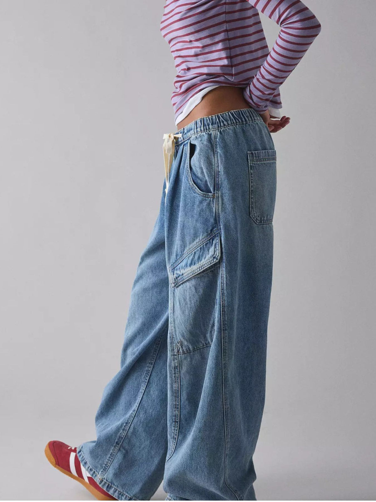 Women’s relaxed fit utility denim cargo jeans with drawstring waist by Plush Fashion Hub, featuring multiple pockets and casual style.