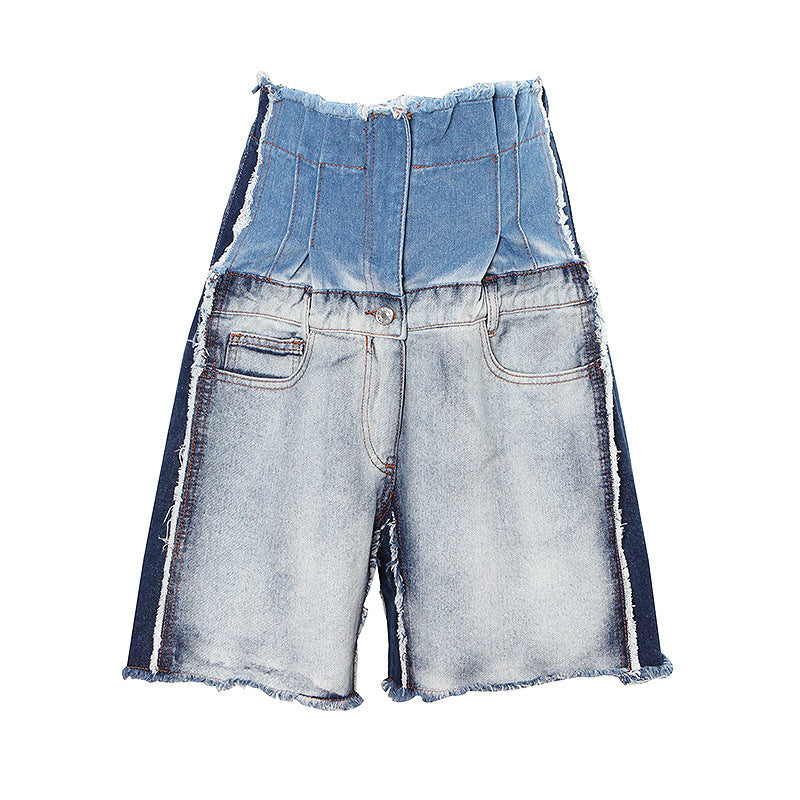 Eprolo high-waist distressed patchwork denim jeans with ripped details and faded finish, shown on a model.