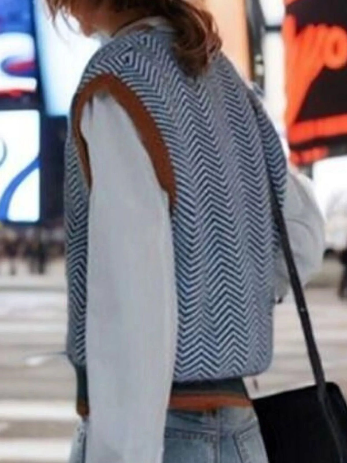 Chevron pattern v-neck knit sweater vest by Trendsi, featuring a stylish design and cozy fit in a close-up image.