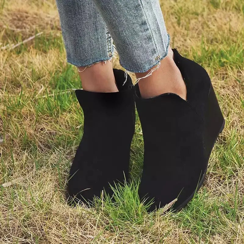 Black high heel ankle boots with side zipper, trendy footwear by Trendsi featuring sleek design and stylish ankle height.