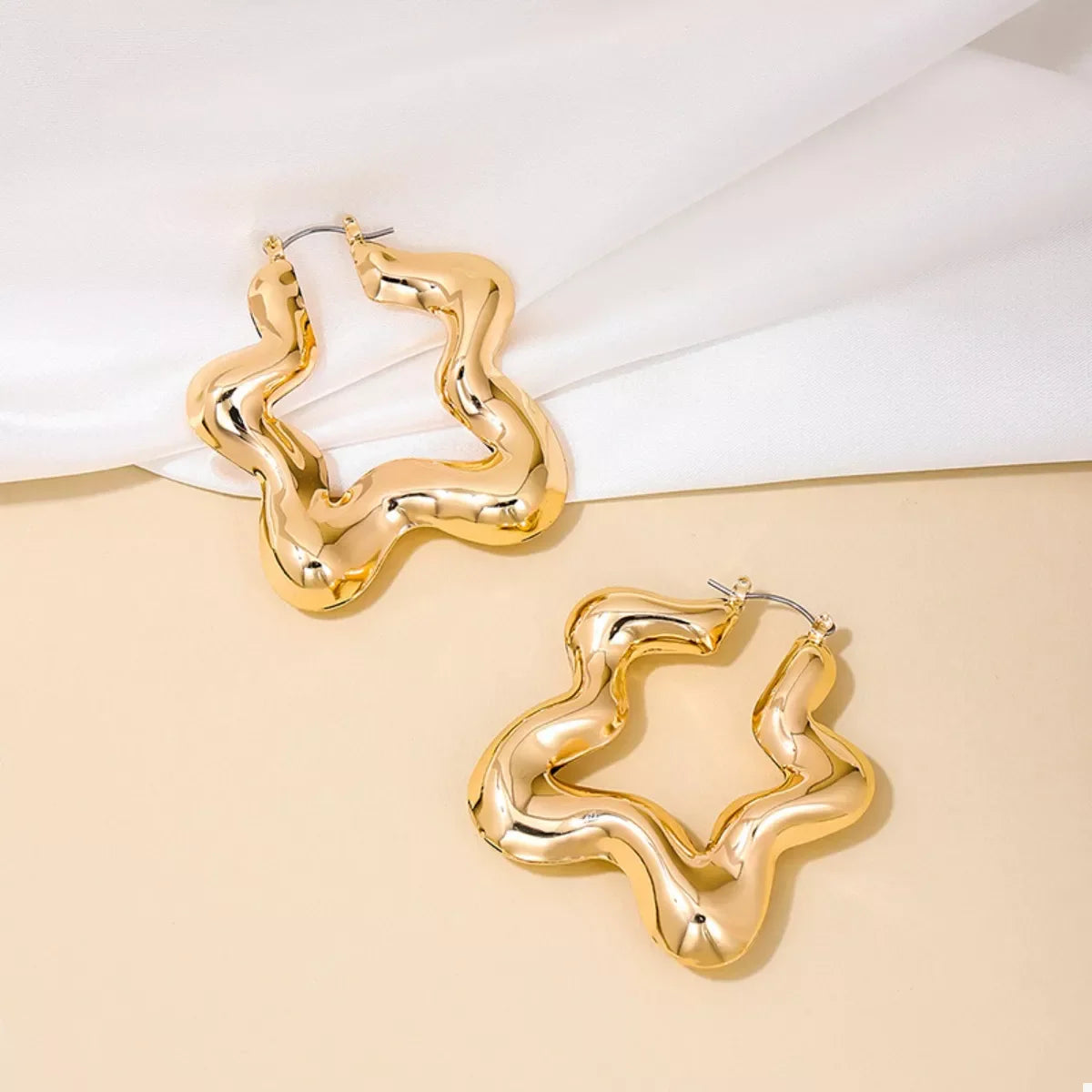 Star-shaped hoop earrings from Plush Fashion Hub, stylish jewelry featuring a star design, perfect for fashion accessories.