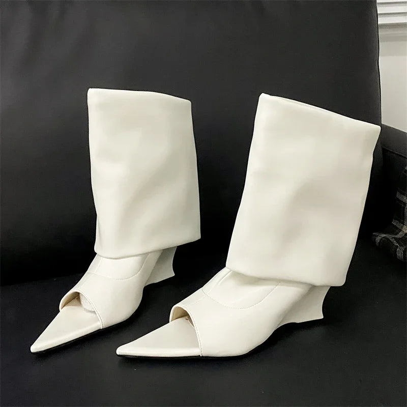 Elegant white faux-leather peep-toe wedge boots with a relaxed, slouchy high-calf shaft and a pointed toe.