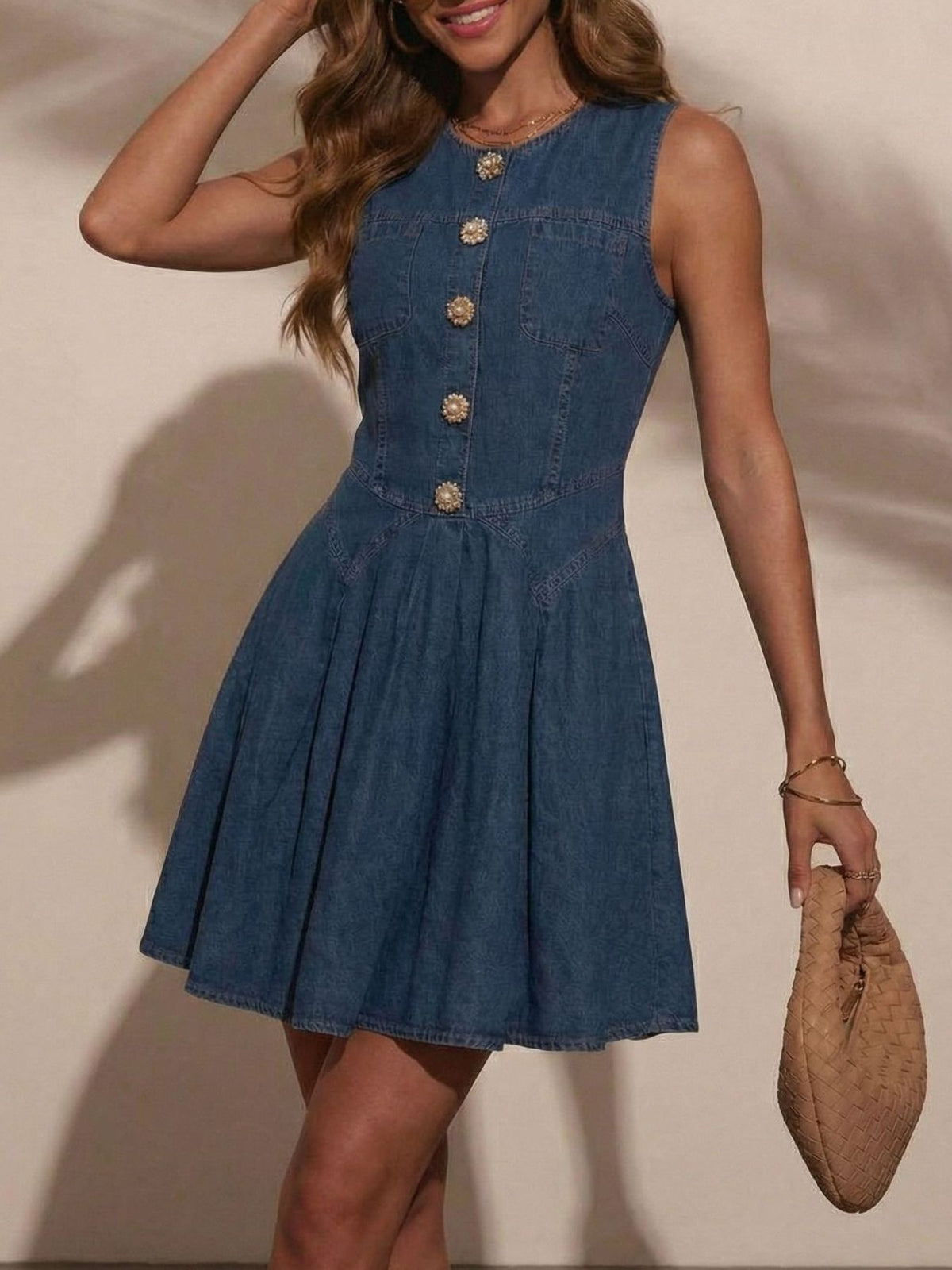 Women's sleeveless denim mini dress by Plush Fashion Hub featuring a stretchy cotton blend fabric and button-front design.