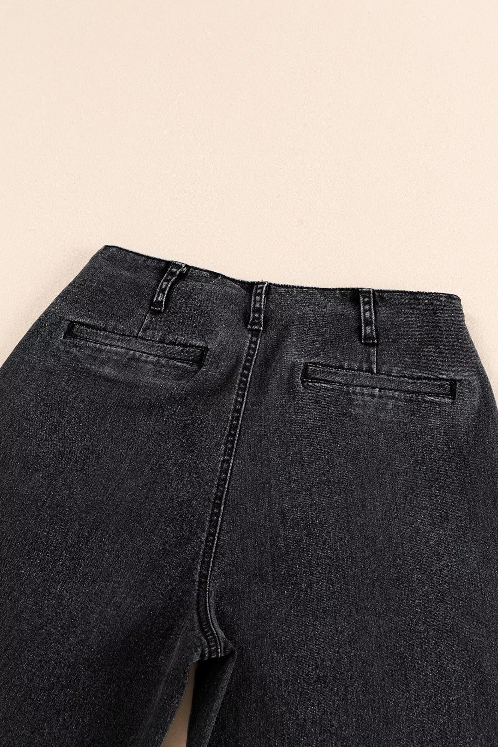 High-waisted Plush Fashion Hub wide-leg jeans with button-fly closure and plush fabric, displayed on a neutral background.