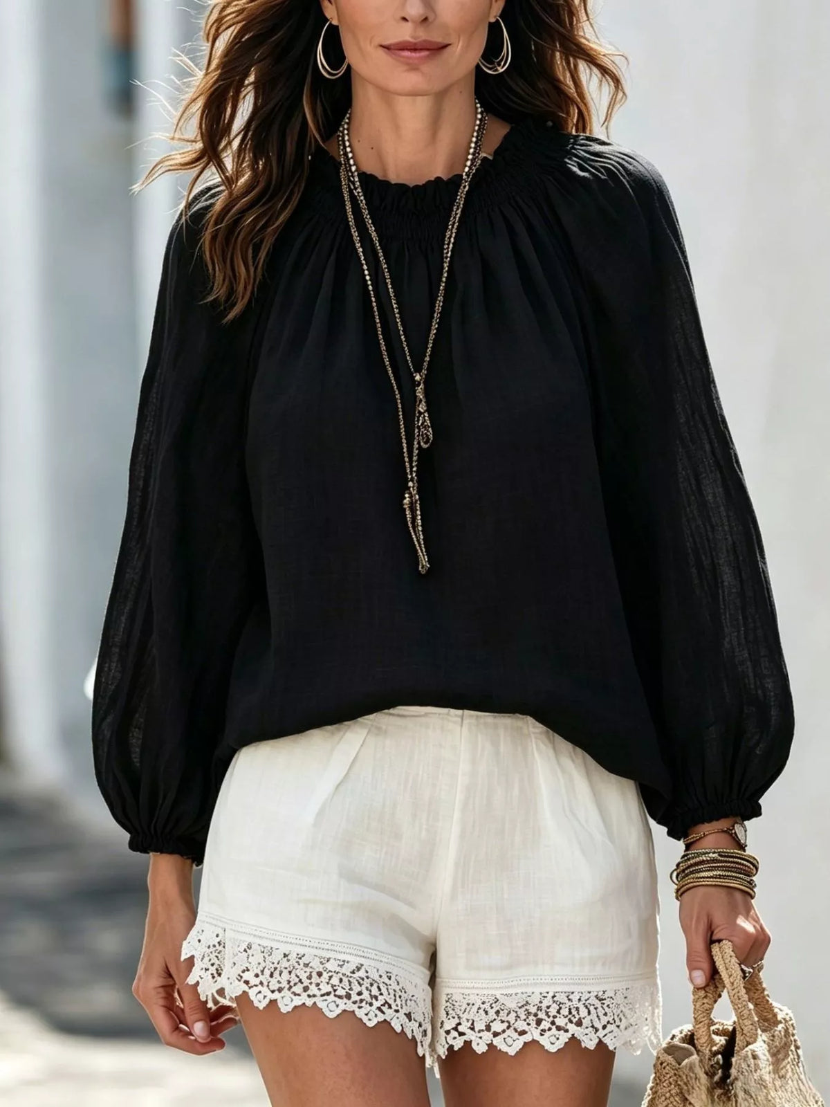Women’s round neck balloon sleeve blouse by Trendsi, featuring a relaxed fit with puffed sleeves and a stylish round neckline.