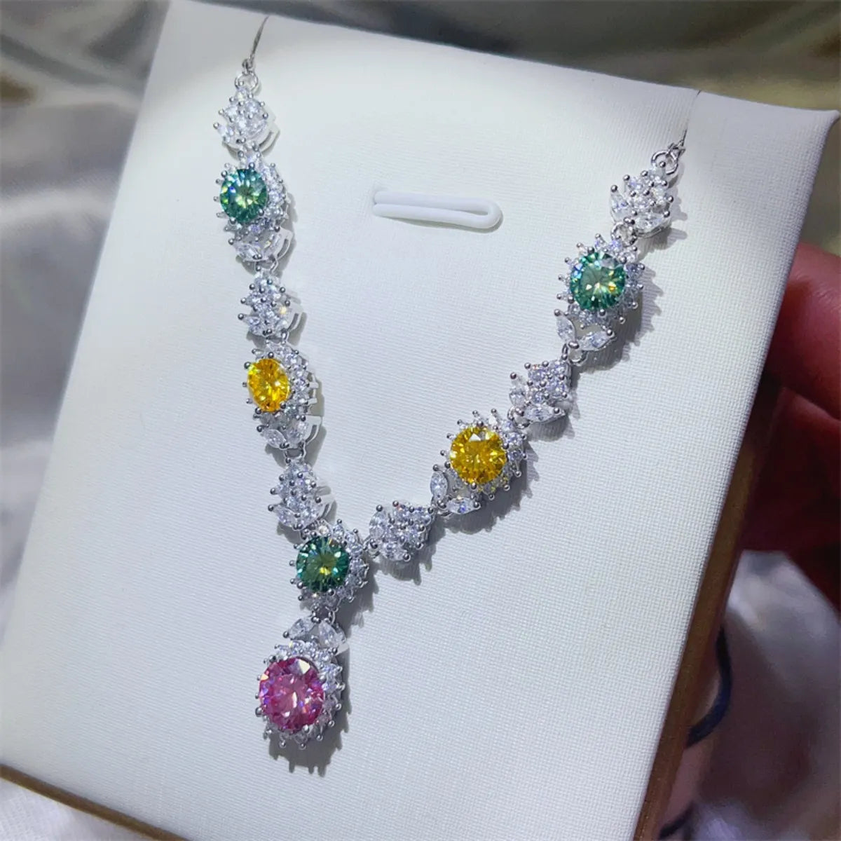 Sterling silver necklace with a 3.5 carat moissanite gemstone, featuring a delicate chain and sparkling centerpiece.