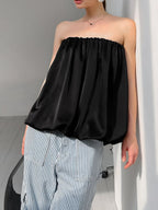 Women’s strapless bubble hem tube top by Trendsi, sleek and trendy minimalist crop top with a fitted design and bubble hem detail.