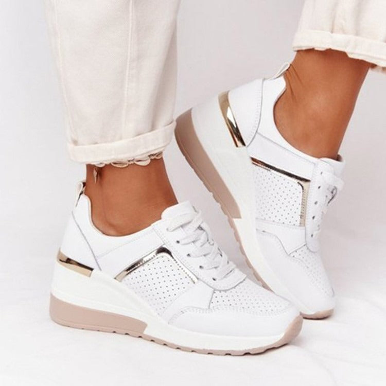 White mesh platform sneakers featuring gold metallic accents, lace-up fronts, and a beige rubber sole.