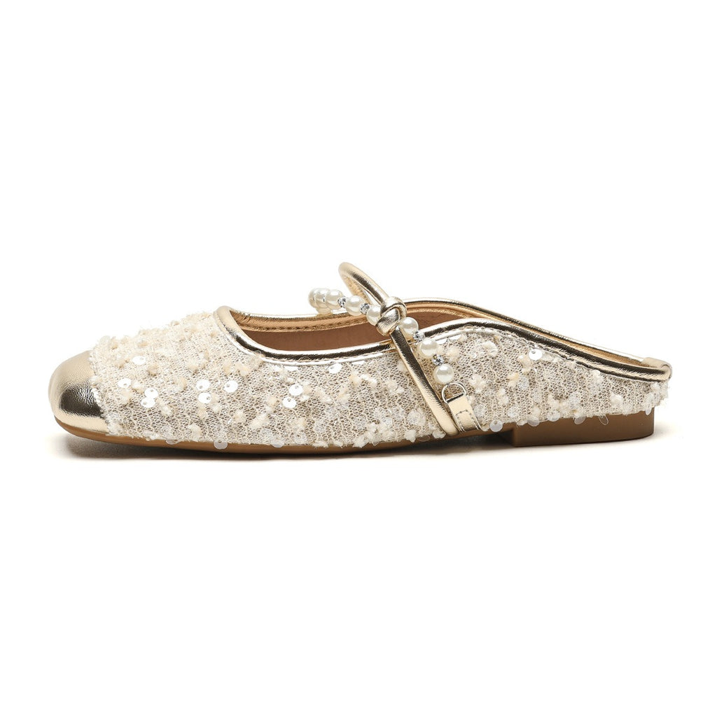 Pearl-embellished minimalist slide sandals by eprolo featuring sleek design and comfortable slip-on style.